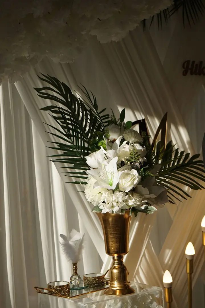 White florals in a gold vase