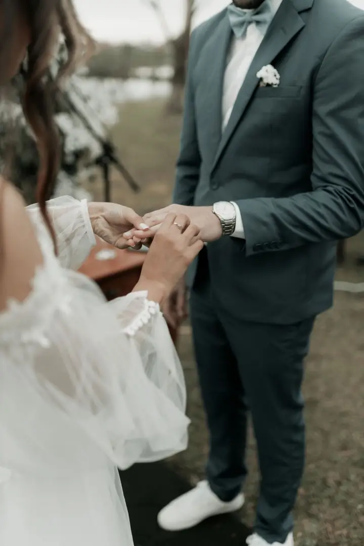 Couple exchanging rings